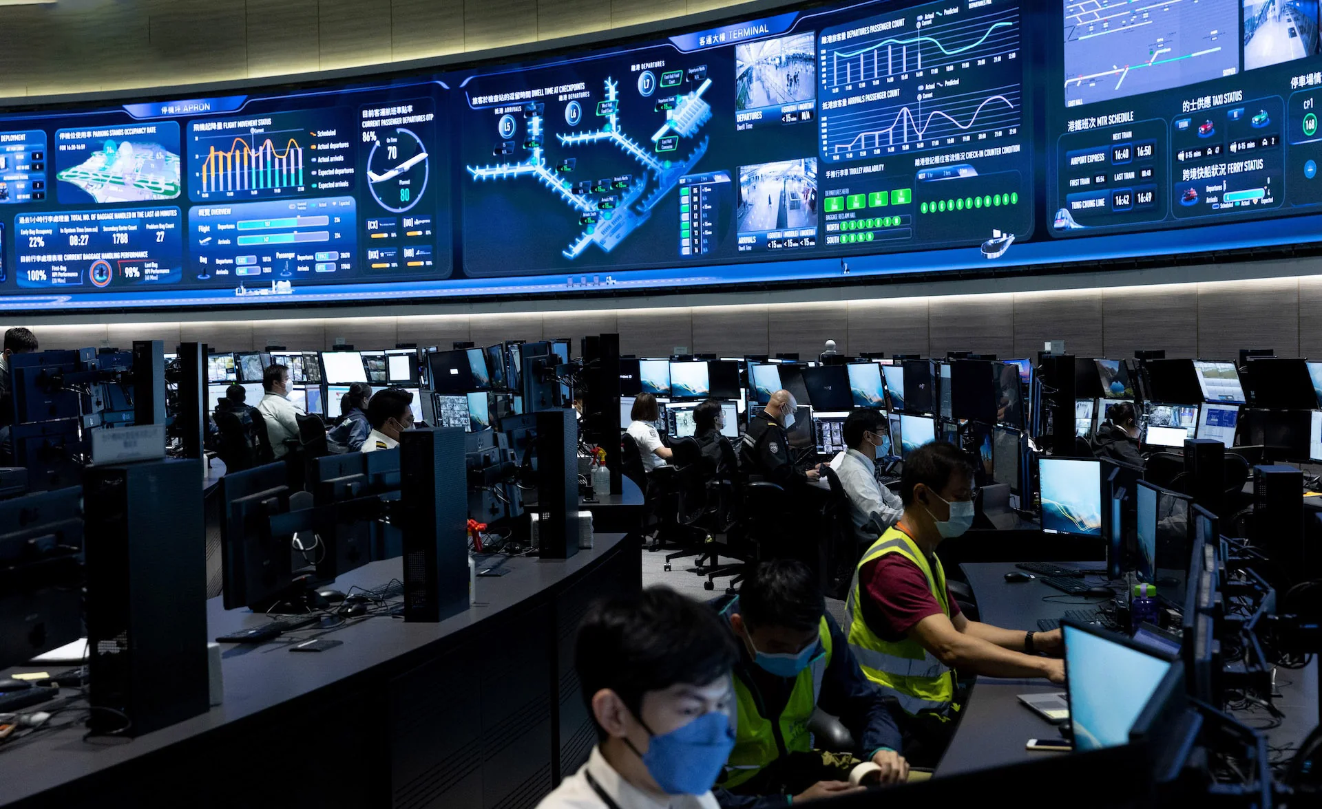 Airport personnel working below the installed Digital Apron display
